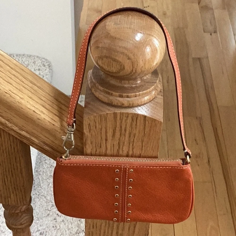 Michael Kors orange, gold tone Studded wristlet, clutch, zipper pouch